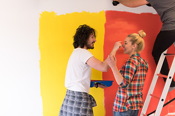 Image showing couple painting interior wall