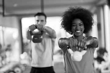 Image showing couple  workout with weights at  crossfit gym