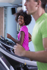 Image showing people exercisinng a cardio on treadmill in gym