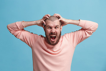 Image showing Handsome man in stress isolated on blue