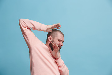 Image showing Portrait of the scared man on blue