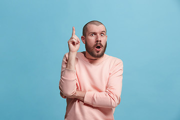 Image showing Young serious thoughtful businessman. Doubt concept.