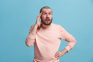 Image showing Young serious thoughtful businessman. Doubt concept.