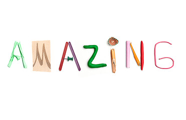 Image showing The word amazing created from office stationery.