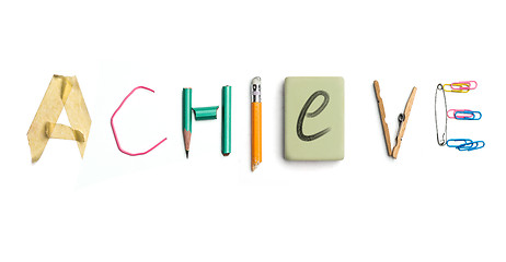 Image showing The word achieve created from office stationery.