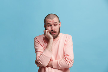 Image showing Beautiful bored man bored isolated on blue background