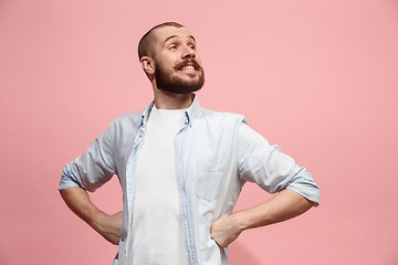 Image showing The happy business man standing and smiling against pastel background.