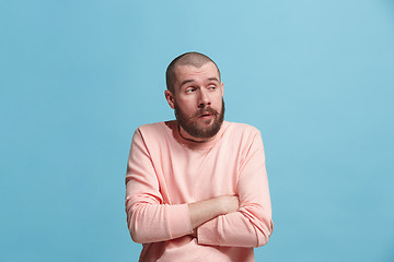 Image showing Beautiful bored man bored isolated on blue background