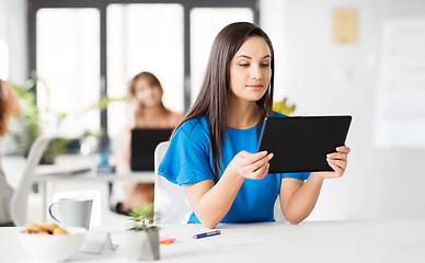 Image showing businesswoman with tablet pc working at office