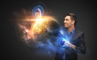 Image showing businessman with virtual planet and space hologram