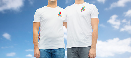 Image showing close up of couple with gay pride rainbow ribbons