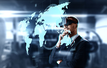 Image showing businessman in virtual headset with world map