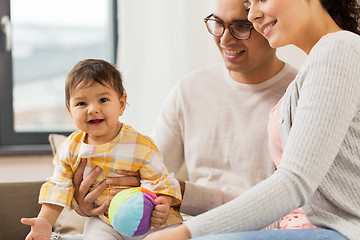 Image showing happy family with baby daughter at home