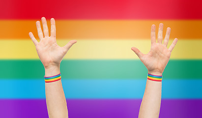 Image showing hands with gay pride rainbow wristbands