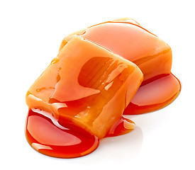 Image showing caramel candies and sauce