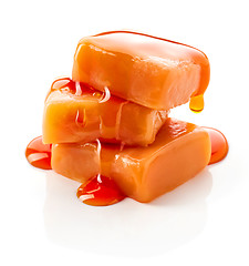 Image showing caramel candies and sauce