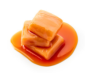 Image showing caramel candies and sauce