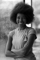 Image showing portrait of young afro american woman in gym while listening mus