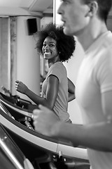 Image showing people exercisinng a cardio on treadmill in gym