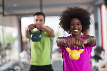 Image showing couple  workout with weights at  crossfit gym