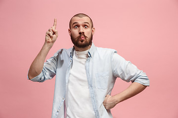 Image showing Young serious thoughtful businessman. Doubt concept.