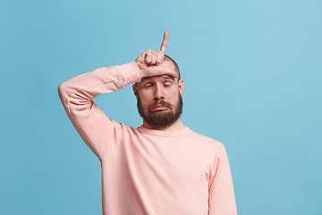 Image showing Handsome man in stress isolated on blue