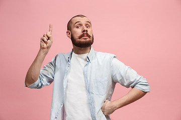 Image showing Young serious thoughtful businessman. Doubt concept.