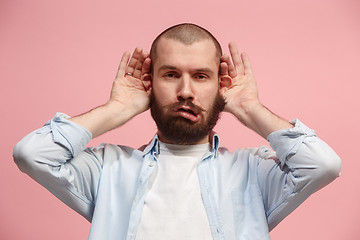 Image showing The squint eyed man with weird expression isolated on pink