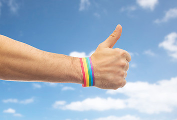 Image showing hand with gay pride rainbow wristband shows thumb