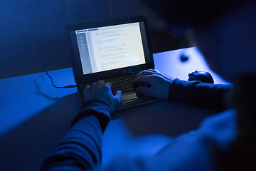 Image showing hacker using laptop for cyber attack