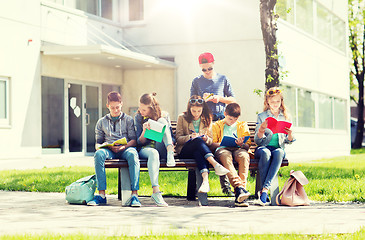 Image showing group of students with notebooks at school yard