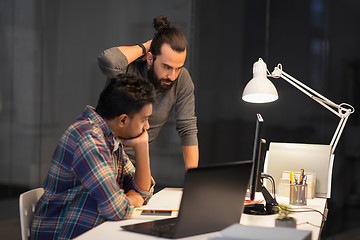 Image showing creative team with computer working late at office