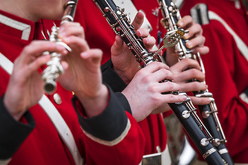 Image showing Clarinet musicians in red uniform