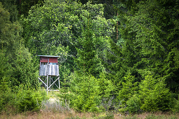 Image showing Wooden hunting tower in a green forest