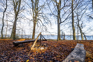 Image showing Camp site with a fireplace and a bench