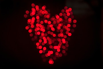 Image showing Heart made of shiny bokeh lights in red color