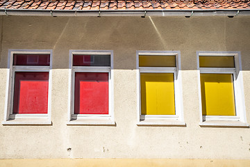 Image showing Four colorful windows on a building