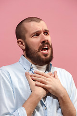 Image showing Isolated on pink young casual man is boring at studio