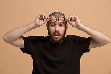 Image showing Beautiful bored man bored isolated on pastel background