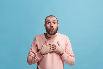 Image showing Portrait of attractive man with kiss isolated over blue background