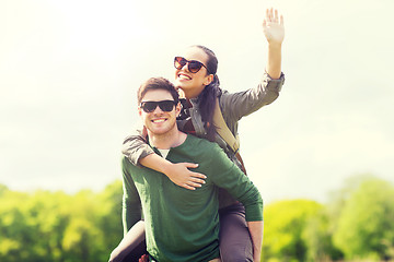 Image showing happy couple with backpacks having fun outdoors