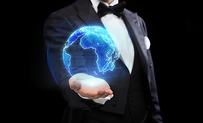 Image showing close up of magician with earth hologram