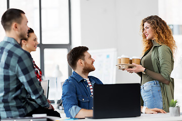 Image showing happy creative team with coffee working at office