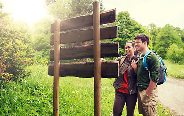 Image showing smiling couple with backpacks hiking