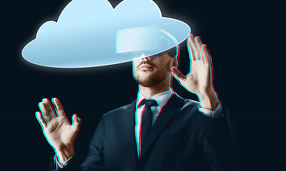 Image showing businessman in virtual reality headset with cloud