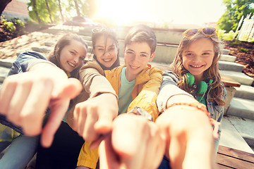 Image showing teenage friends or students pointing finger at you