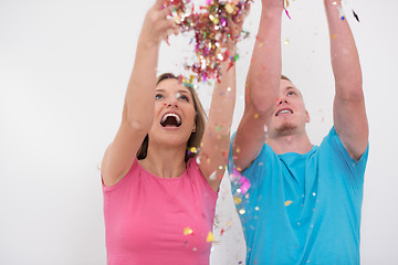 Image showing romantic young  couple celebrating  party with confetti