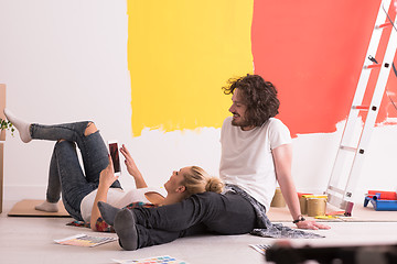 Image showing Happy young couple relaxing after painting