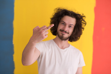 Image showing young man with funny hair over color background