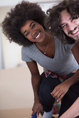 Image showing multiethnic couple renovating their home